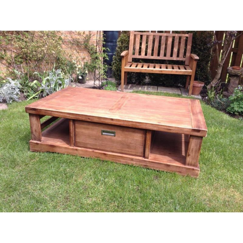 Substantial solid oak coffee table with 2 storage spaces and spacious drawer very good condition