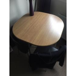 Circular table and 4 brown leather chairs