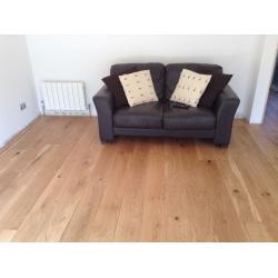 Brown leather sofa & footstool