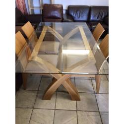 Lovely solid wood and glass dining table and 4 chairs.