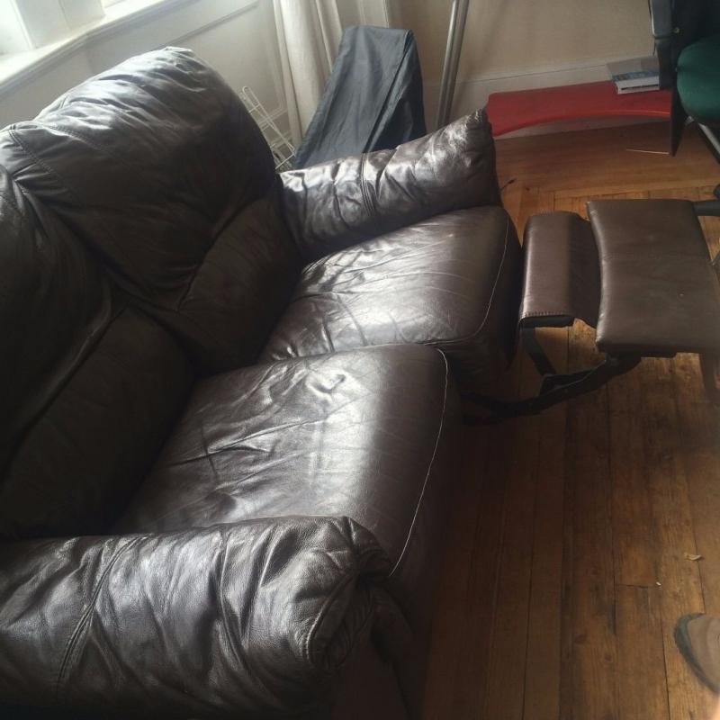 Double reclining brown leather sofa