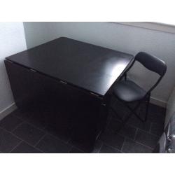 Folding down table with storage cupboard for 4 chairs