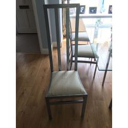 Glass topped table and six chairs