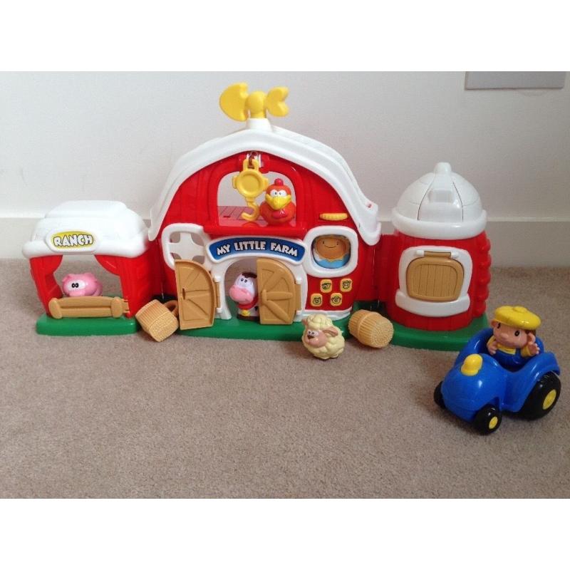 Little people barn with farm animals, hay, farmer and tractor, has buttons/sounds/music