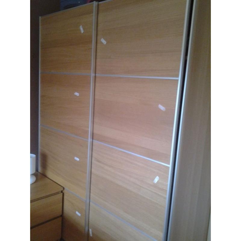 Wardrobe with pair of sliding doors in oak veneer - PAX from IKEA