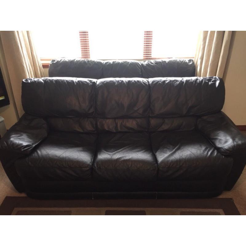 Two black leather sofas