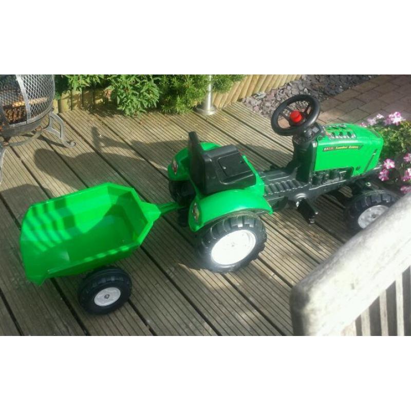 Ride on pedal powered tractor & trailer.