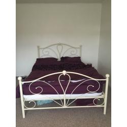 Cream double bed and mattress