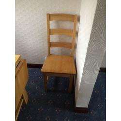 Large wooden table and chairs with folding leafs