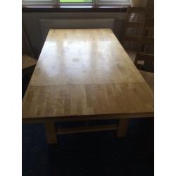 Large wooden table and chairs with folding leafs