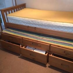 Single wooden bed with pull out guest bed ad three draws