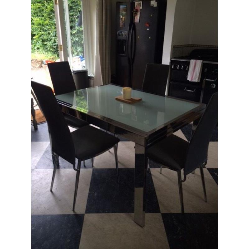 Glass and Metal Table and 6 Grey Chairs