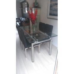 glass dining table and 4 chairs