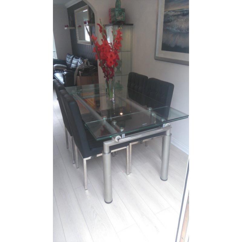 glass dining table and 4 chairs