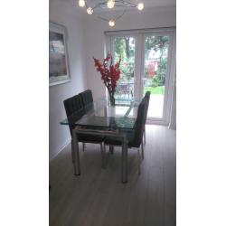 glass dining table and 4 chairs