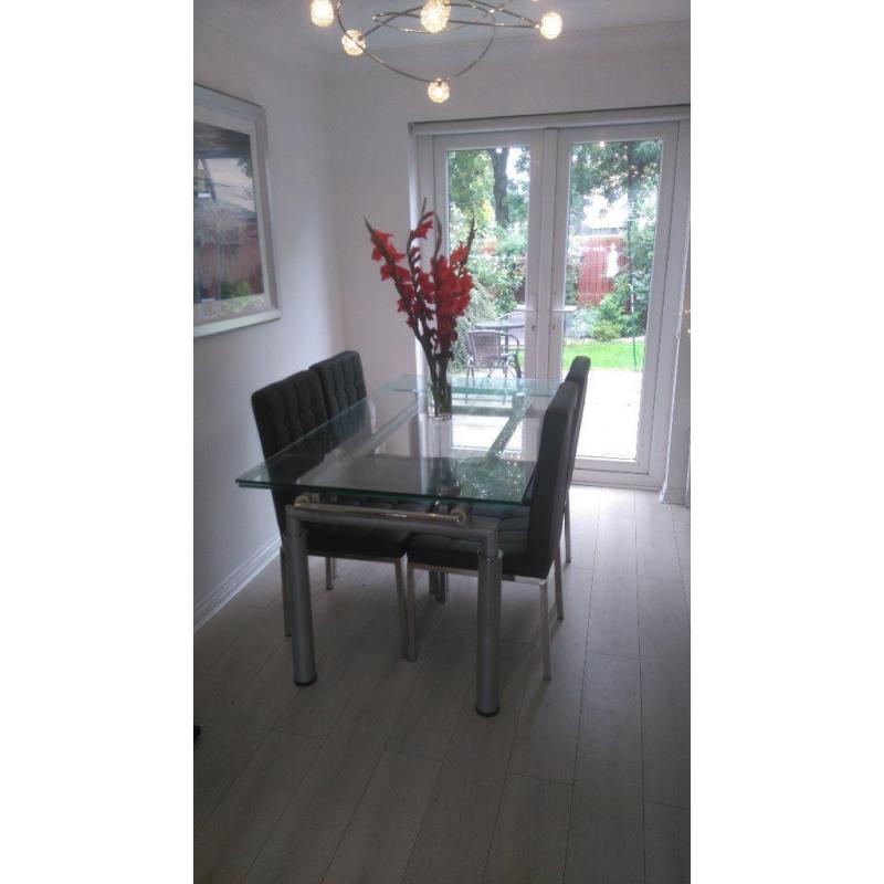 glass dining table and 4 chairs