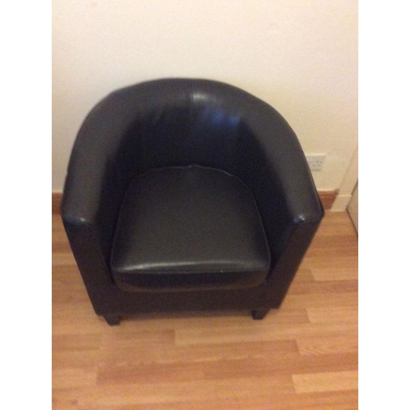 Brown leather tub chair