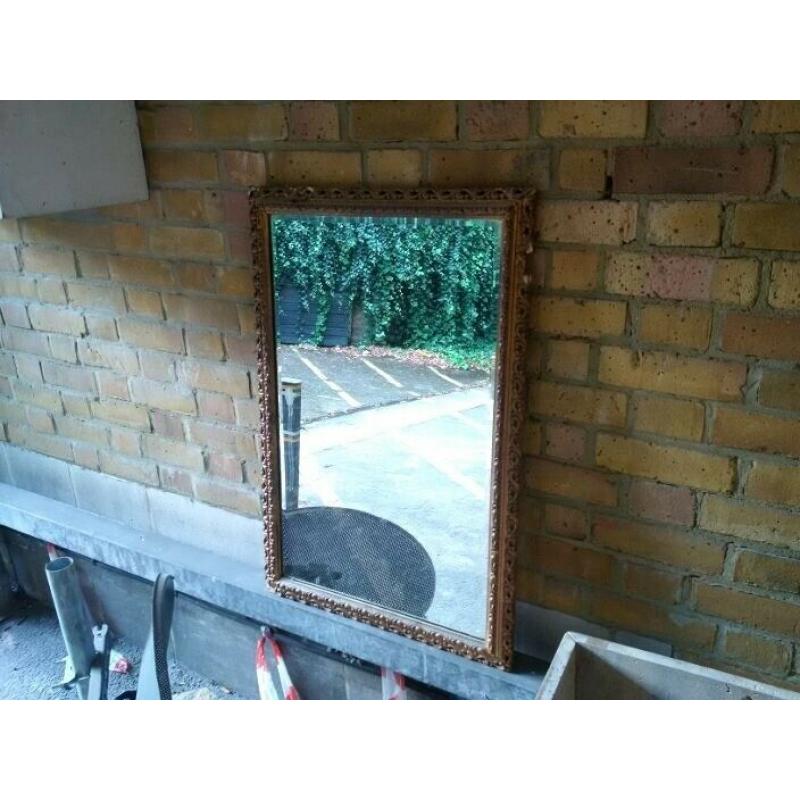 old wall mirror with ornate frame