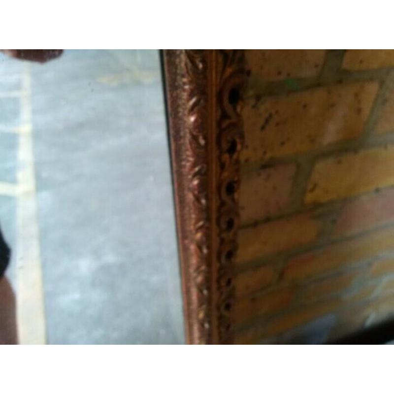 old wall mirror with ornate frame